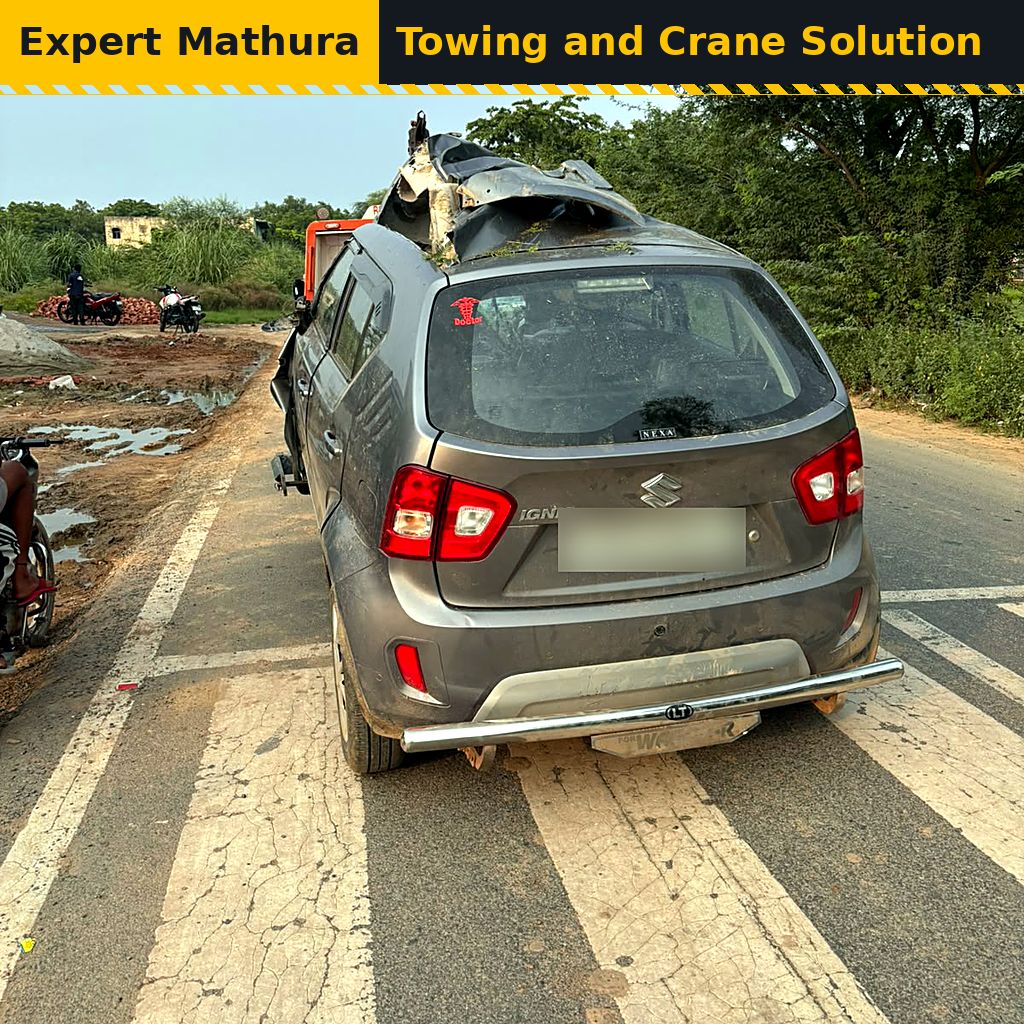 Damaged grey hatchback with a crushed roof after an accident, vehicle recovery in Mathura