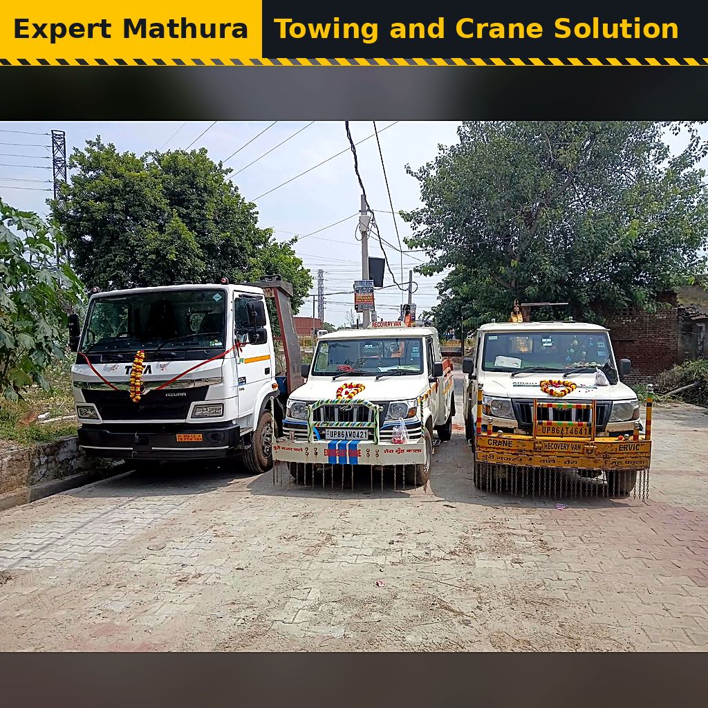 Expert Mathura Towing and Crane Solution fleet: crane recovery vans and a platform truck parked side by side