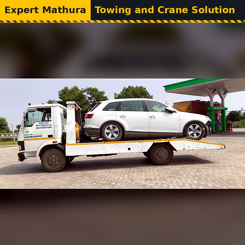 White SUV carried on a platform truck, flatbed towing from Mathura